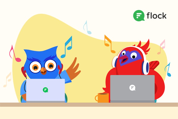 Two birds working on their laptops and listening to music with headphones