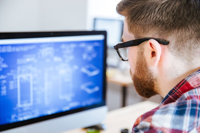 man staring at a computer screen