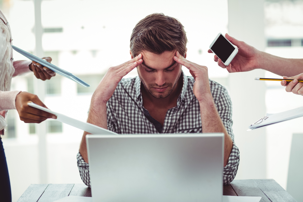 Businessman stressed out at work in casual office